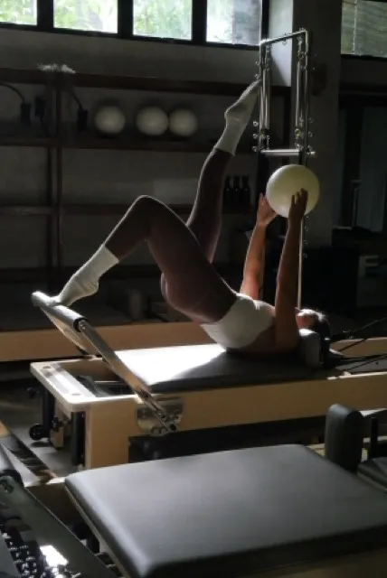 Pilates reformer session with stability ball at Feral Pilates studio