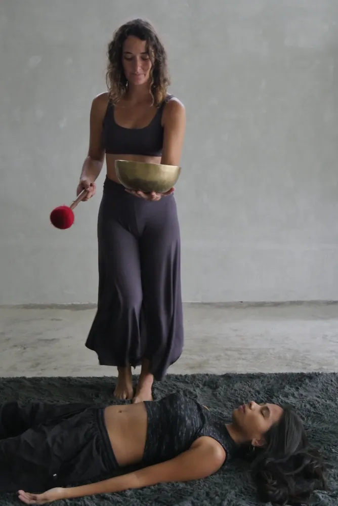 Tibetan singing bowl closeup during sound healing at Holding Space by Vultun