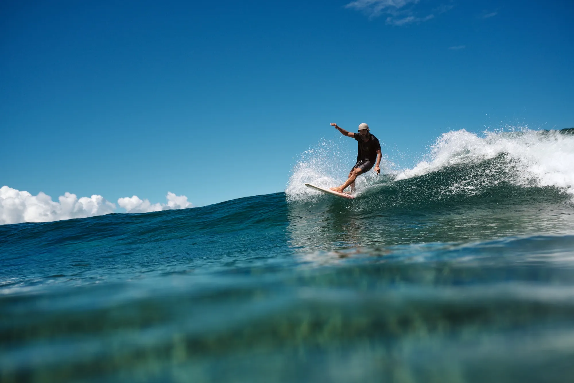 Jay Sueno performing a standing cutback on a wave at Jacking Horse Beach Siargao