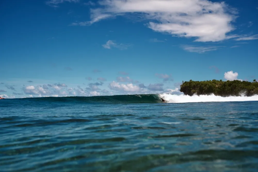 Clean wave breaking near Rock Island off the coast of Siargao