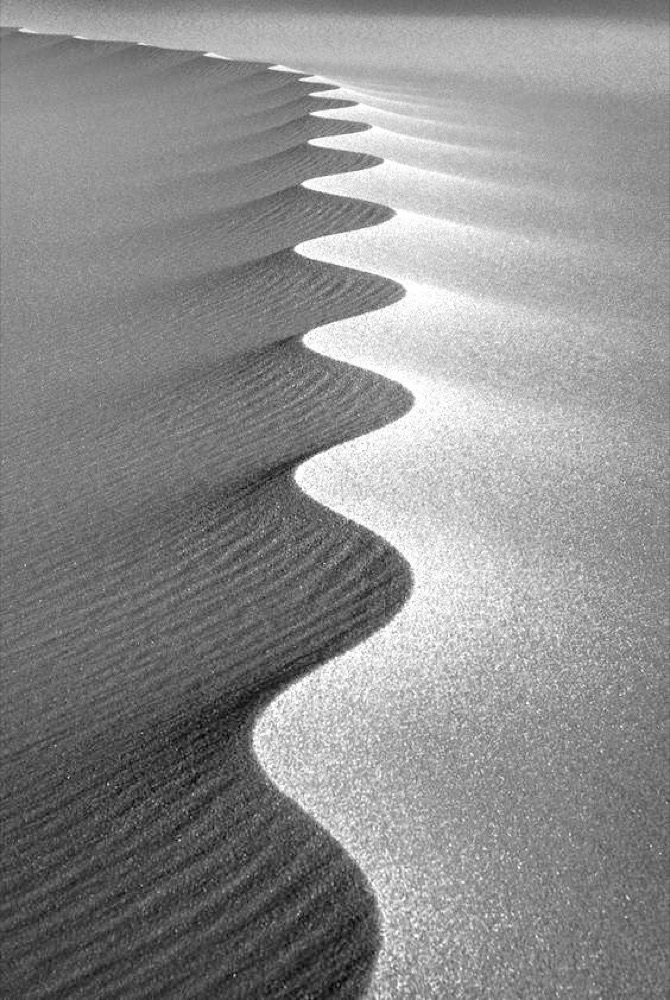 Black and white sand dune ripples — natural patterns and flow